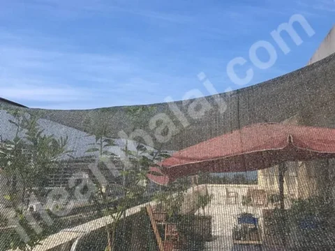 balkon-golgeligi-55lik-yesil-seritli-kapak